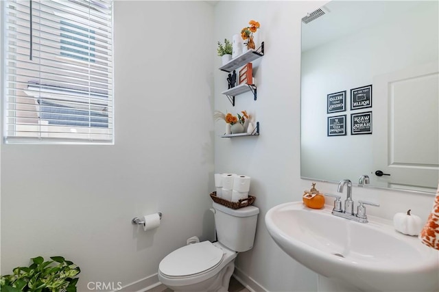 bathroom with toilet and sink