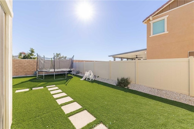 view of yard featuring a trampoline