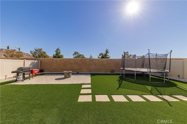 view of yard with a patio area and a trampoline