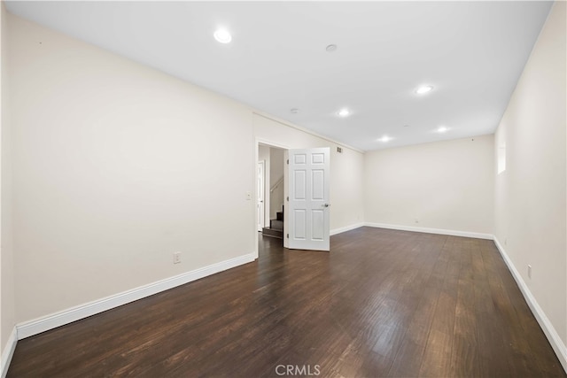 unfurnished room featuring dark hardwood / wood-style flooring