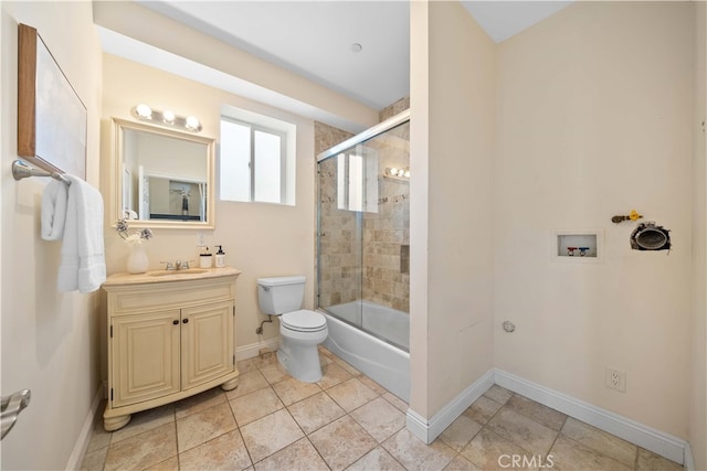 full bathroom with tile patterned floors, vanity, toilet, and enclosed tub / shower combo