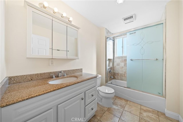 full bathroom with toilet, combined bath / shower with glass door, and vanity