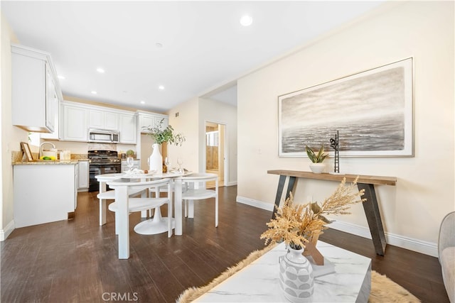 dining space featuring dark hardwood / wood-style floors