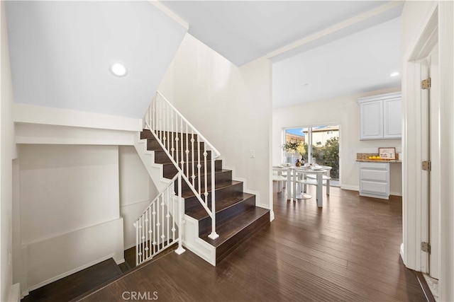 stairs with hardwood / wood-style floors