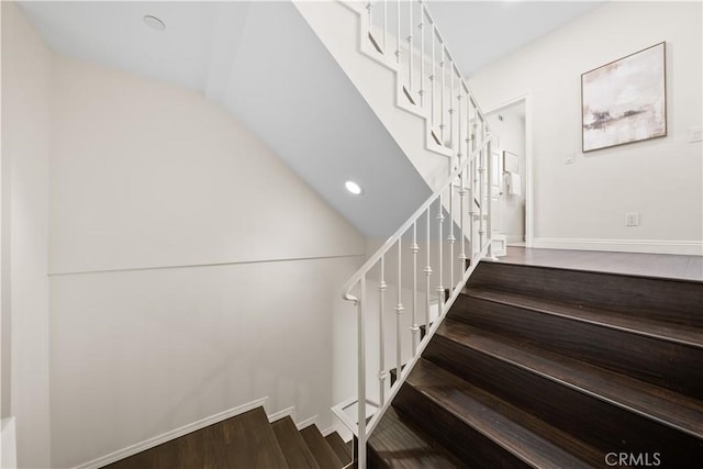 stairway featuring hardwood / wood-style flooring