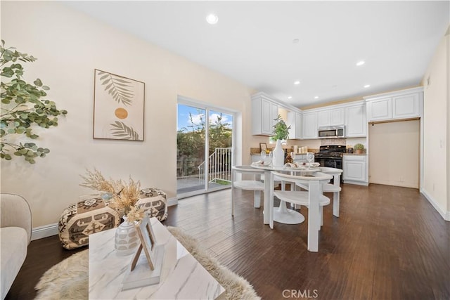 dining area with dark wood-type flooring