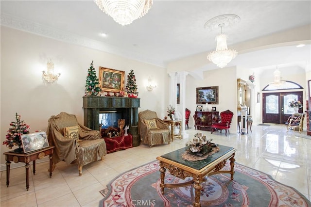 living room featuring a multi sided fireplace, french doors, and an inviting chandelier