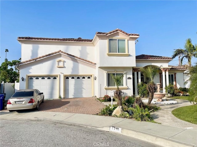 mediterranean / spanish-style home featuring a garage