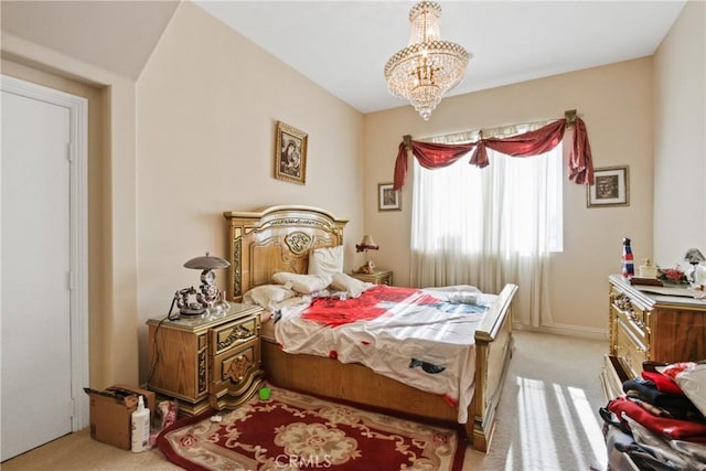 bedroom featuring light carpet and a notable chandelier