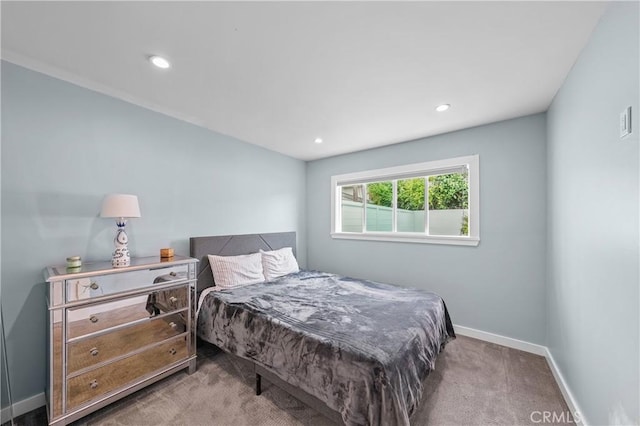 bedroom featuring light carpet