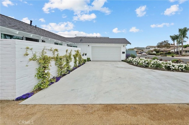 view of side of property featuring a garage