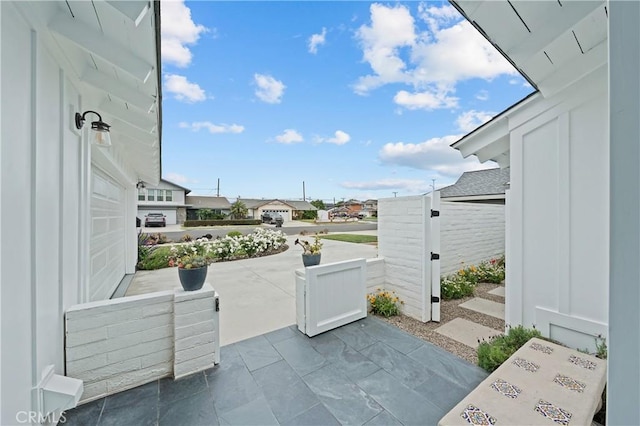 view of patio featuring a garage