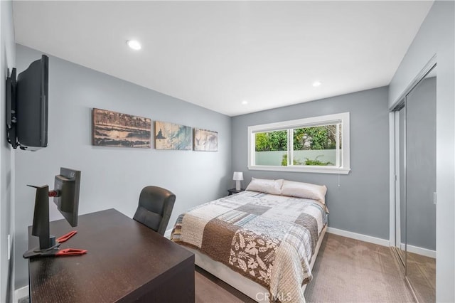 carpeted bedroom featuring a closet