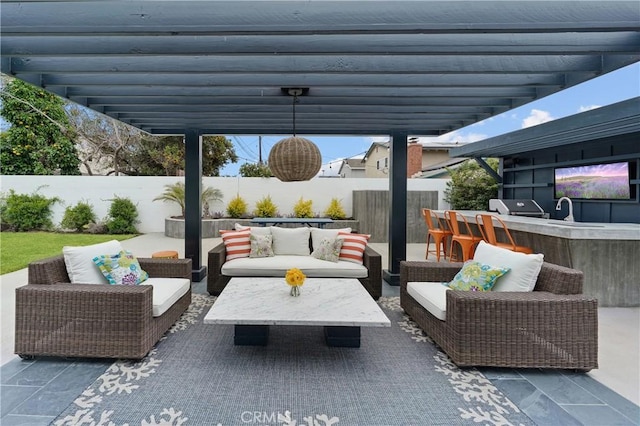 view of patio featuring outdoor lounge area, an outdoor kitchen, a pergola, and a grill