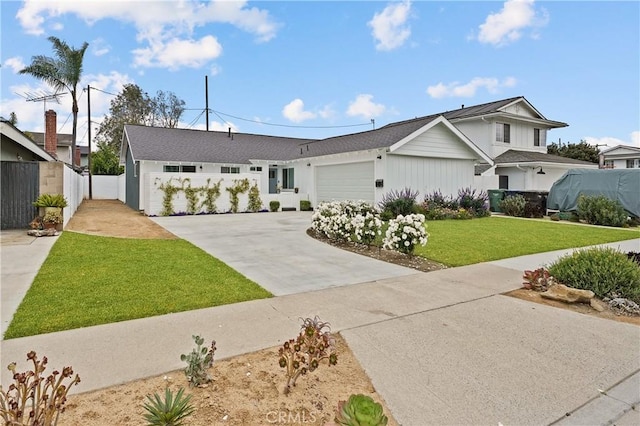 view of front facade featuring a garage and a front lawn