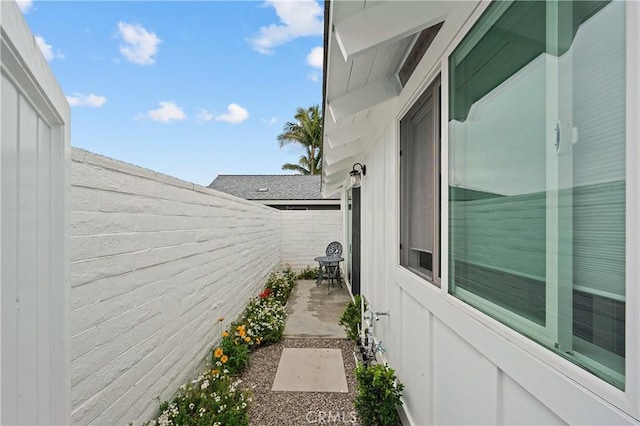 view of side of home featuring a patio