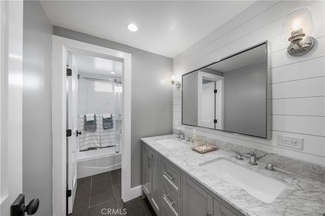 bathroom with tile patterned flooring, vanity, and tub / shower combination