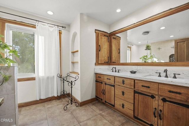 bathroom with vanity and tile patterned flooring