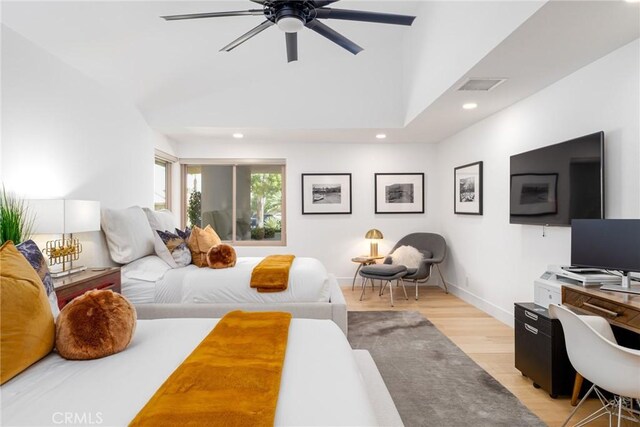 bedroom with ceiling fan and light wood-type flooring