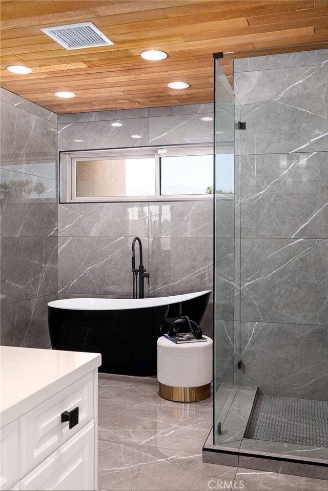 bathroom featuring vanity, separate shower and tub, tile walls, and wood ceiling