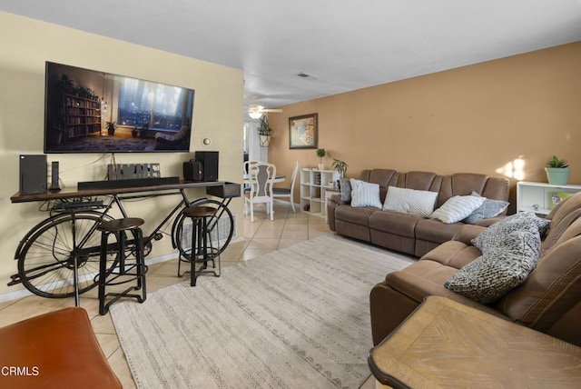 tiled living room with ceiling fan