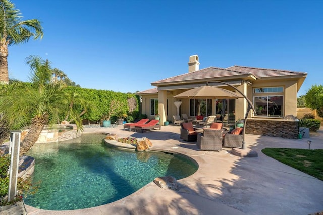 view of swimming pool with an outdoor hangout area and a patio