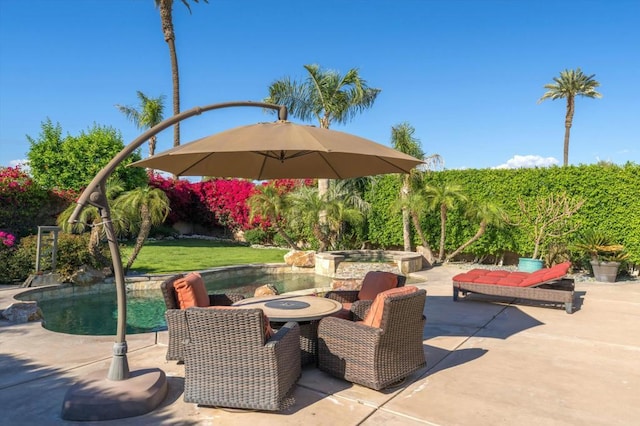 view of patio with a pool with hot tub