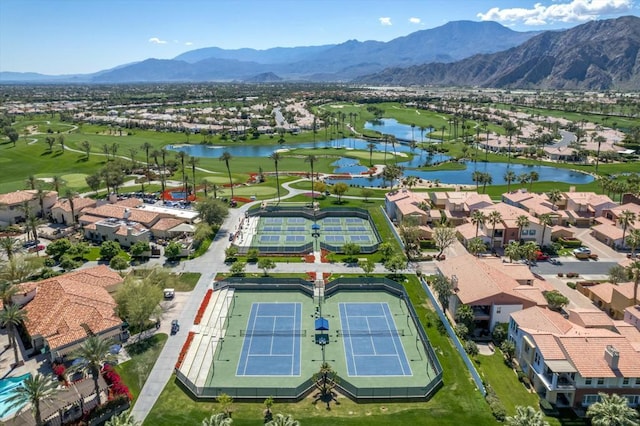 drone / aerial view with a water and mountain view