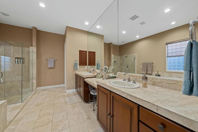 bathroom with tile patterned flooring, vanity, and an enclosed shower