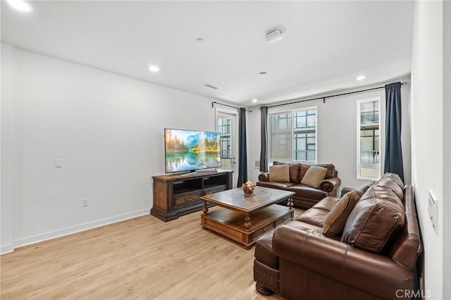 living room with light hardwood / wood-style flooring