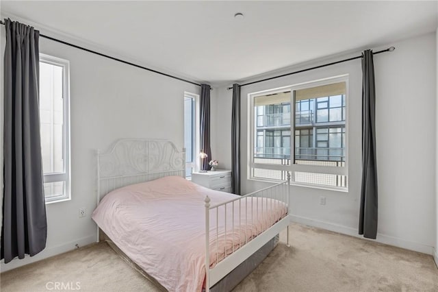 bedroom with light colored carpet