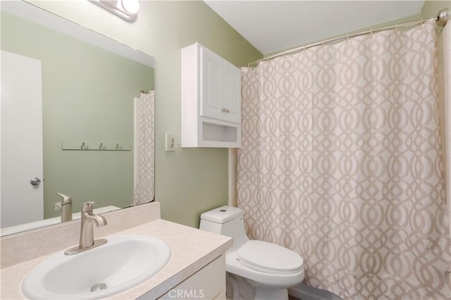 bathroom with toilet and vanity