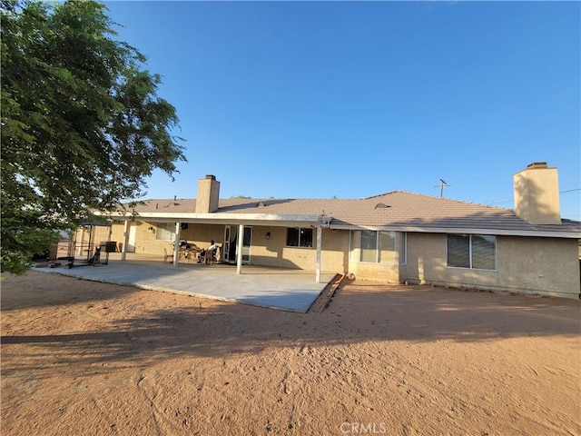 back of property featuring a patio area