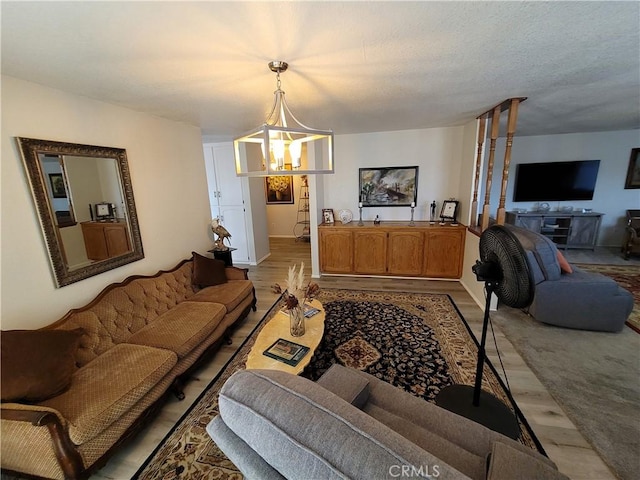 living room featuring light carpet and an inviting chandelier