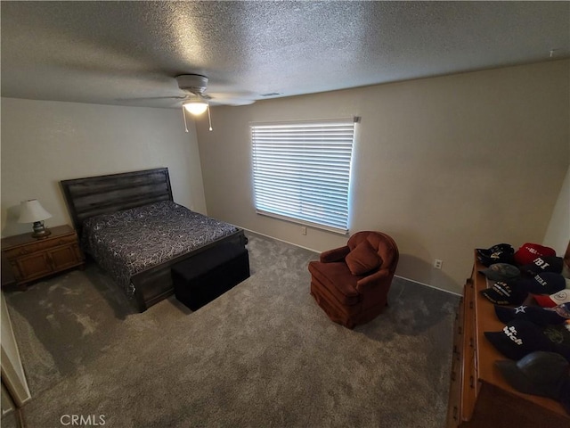 bedroom with dark colored carpet, ceiling fan, and a textured ceiling