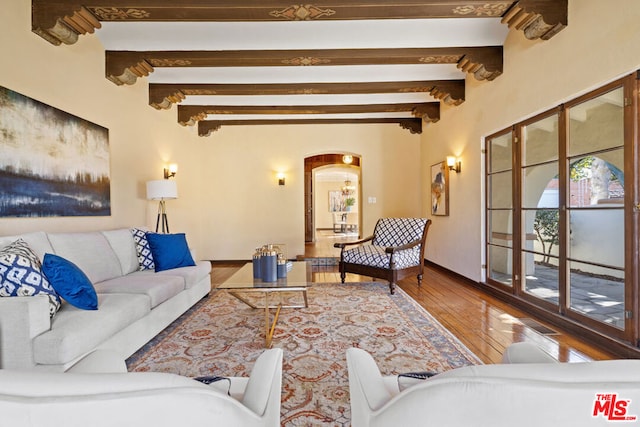 living room with beamed ceiling and hardwood / wood-style floors