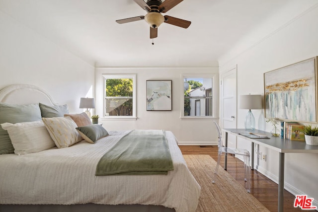 bedroom with wood-type flooring and ceiling fan