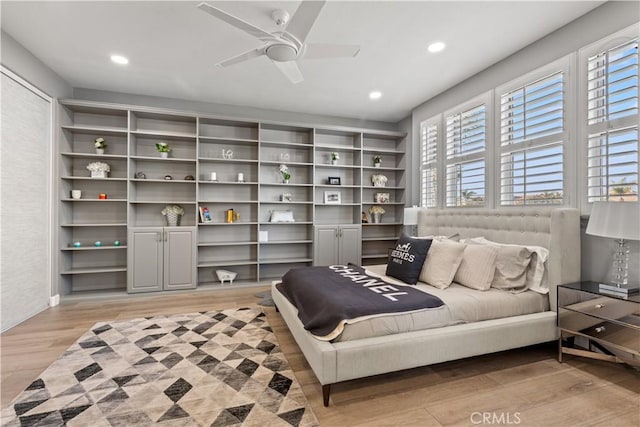 bedroom featuring ceiling fan and light wood-type flooring