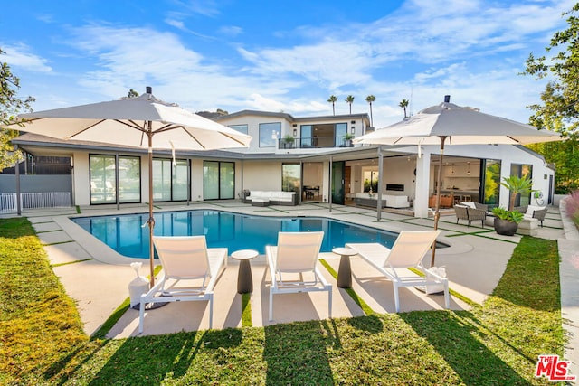 view of pool featuring a patio and an outdoor hangout area