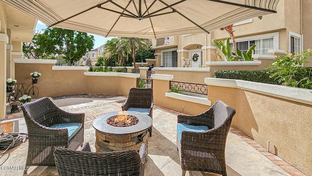 view of patio / terrace with a gazebo and an outdoor fire pit