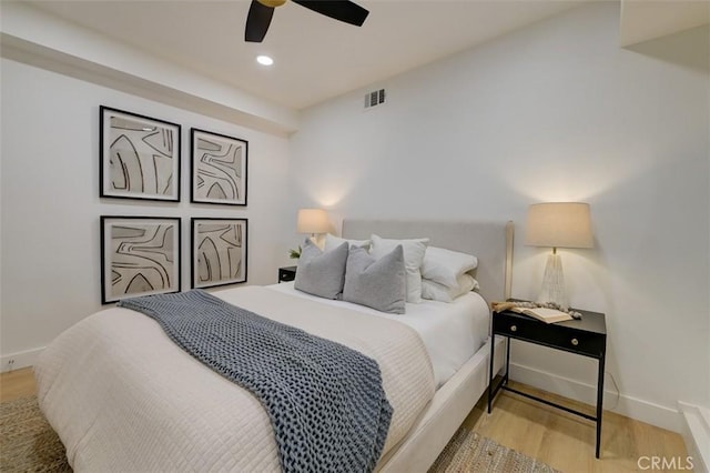 bedroom featuring light wood-type flooring and ceiling fan