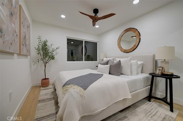 bedroom featuring ceiling fan and light hardwood / wood-style flooring