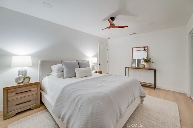 bedroom featuring ceiling fan and light wood-type flooring