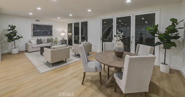 dining room with wood-type flooring