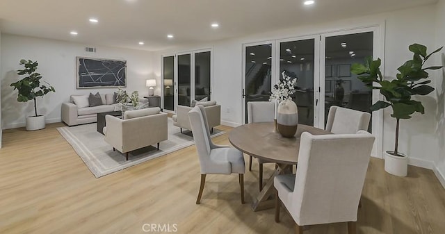 dining room featuring recessed lighting, visible vents, baseboards, and wood finished floors