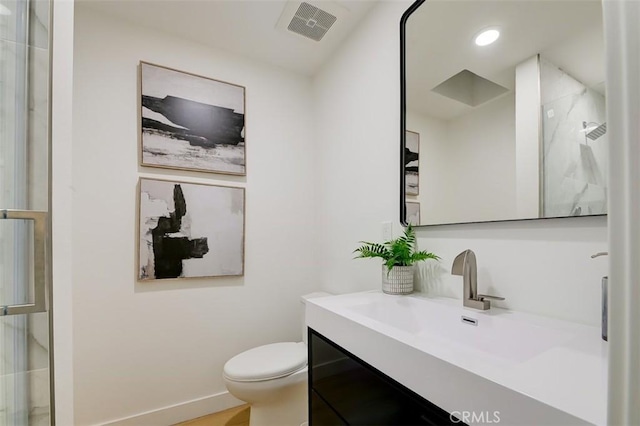 bathroom with recessed lighting, visible vents, toilet, vanity, and baseboards