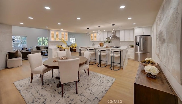 dining space featuring light wood-style floors and recessed lighting