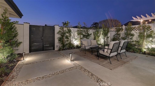 patio terrace at dusk with an outdoor hangout area