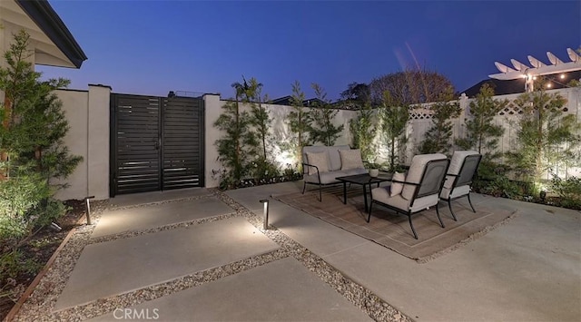 view of patio featuring a gate, fence, and an outdoor hangout area