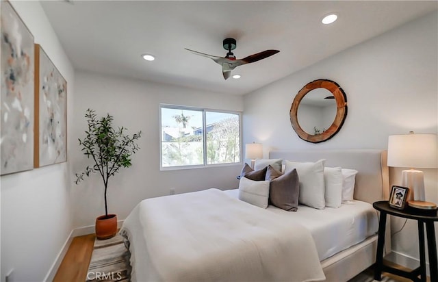 bedroom with ceiling fan and hardwood / wood-style flooring